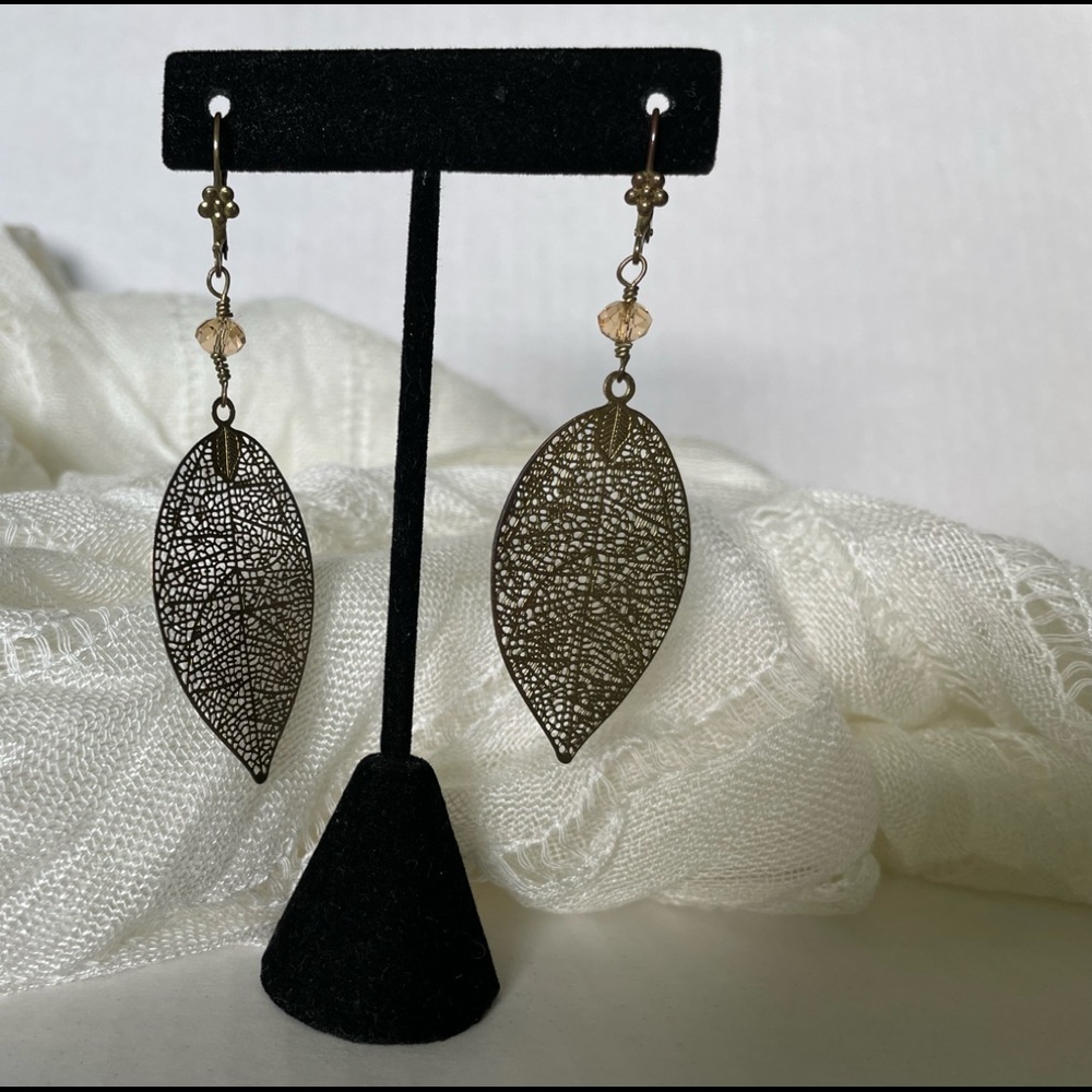 Gold tone leaf dangling lever back earrings